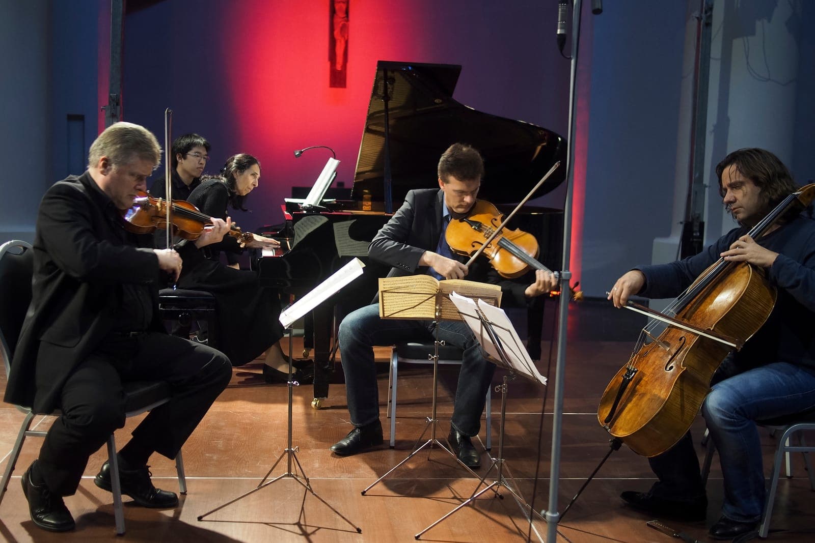 Festival quartet performing on a lit stage